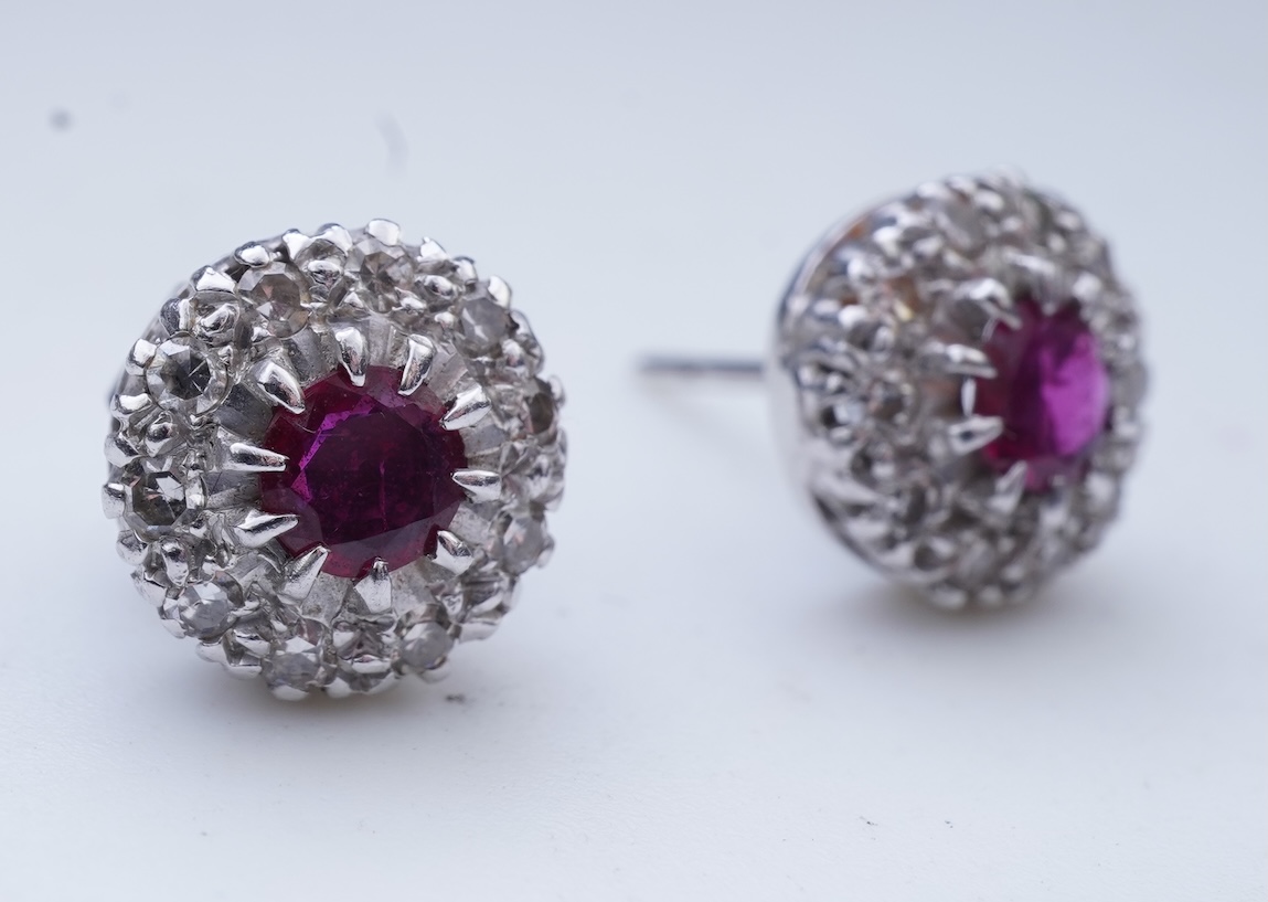A pair of ruby and diamond earrings